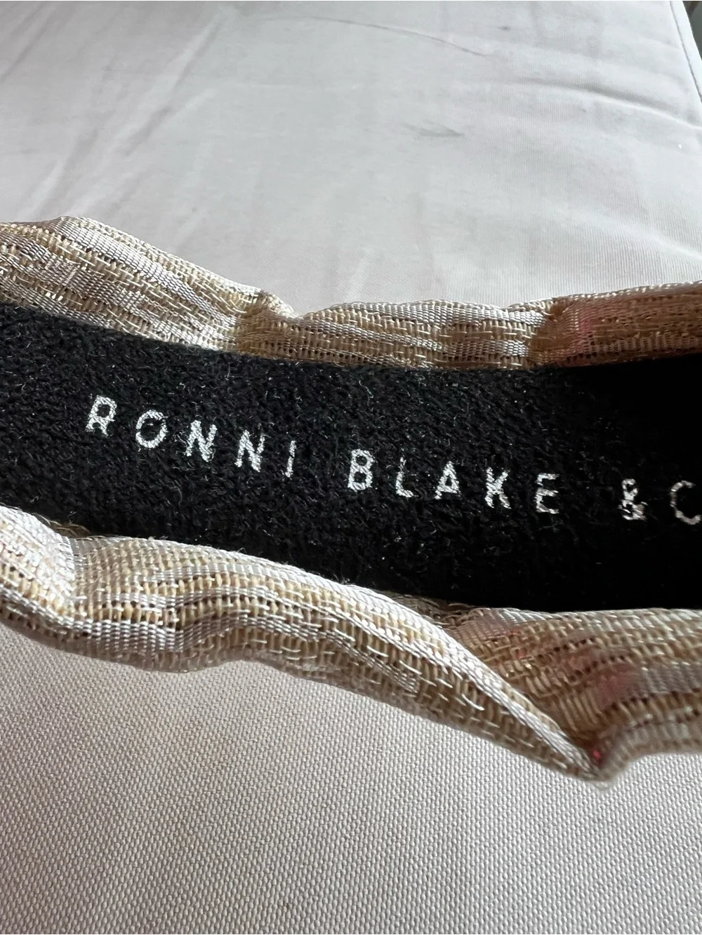 Package of six multi-color and brand headbands.